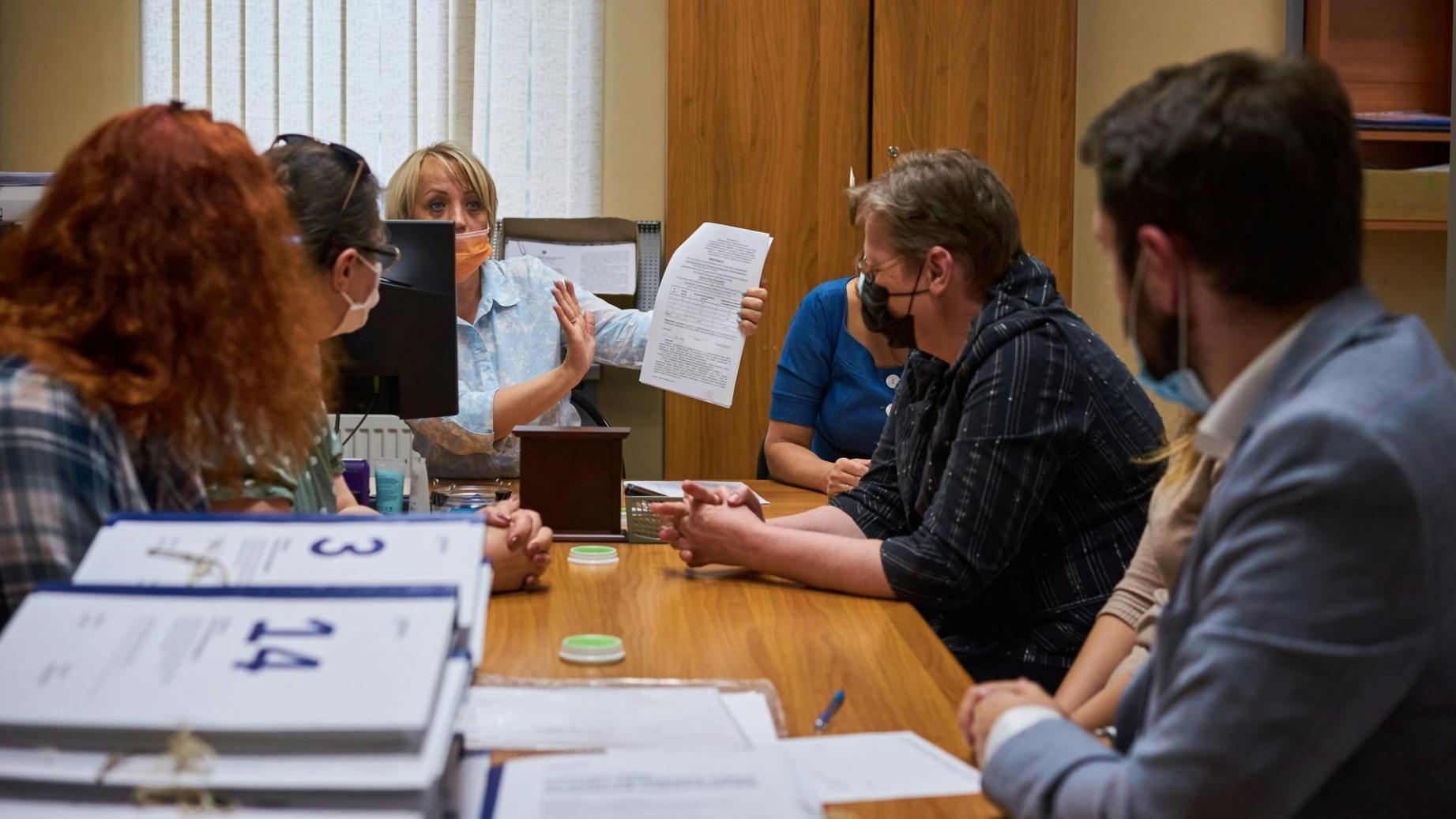 Team member reviewing community feedback on budget resources